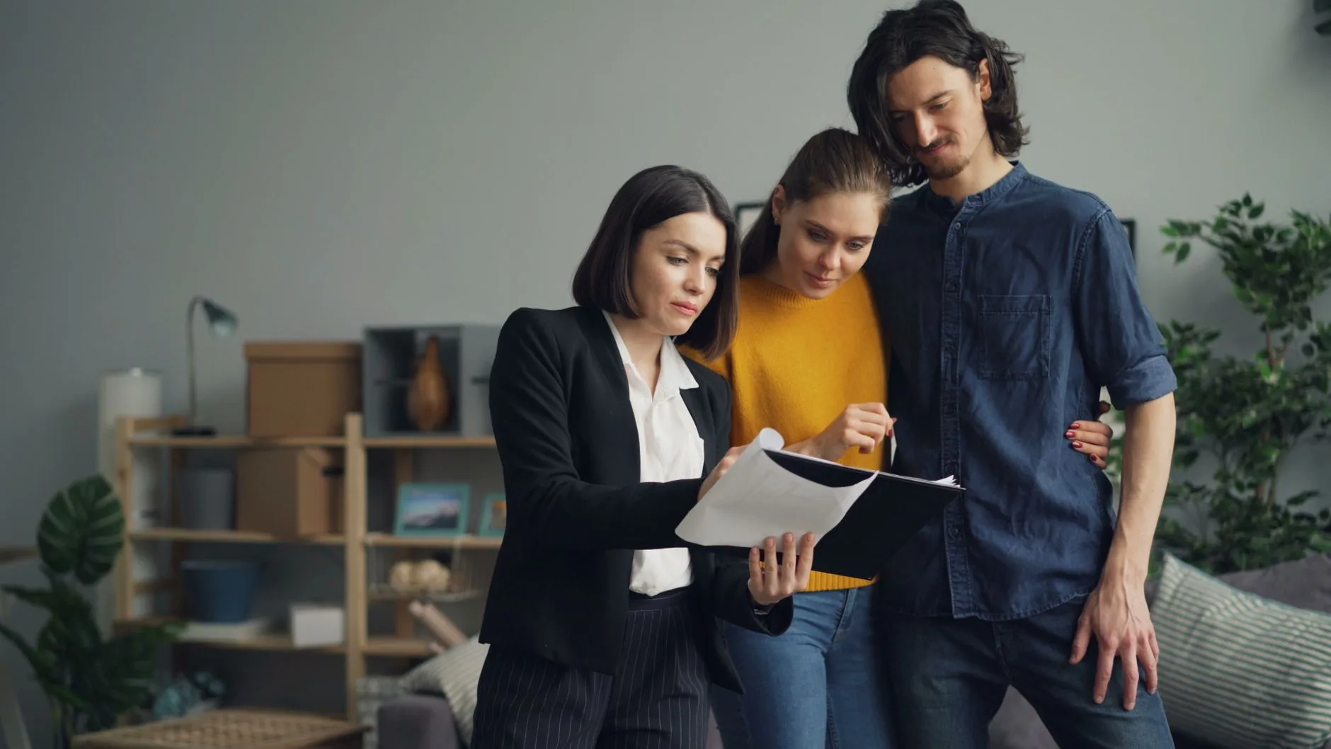 couple with expert reading a document